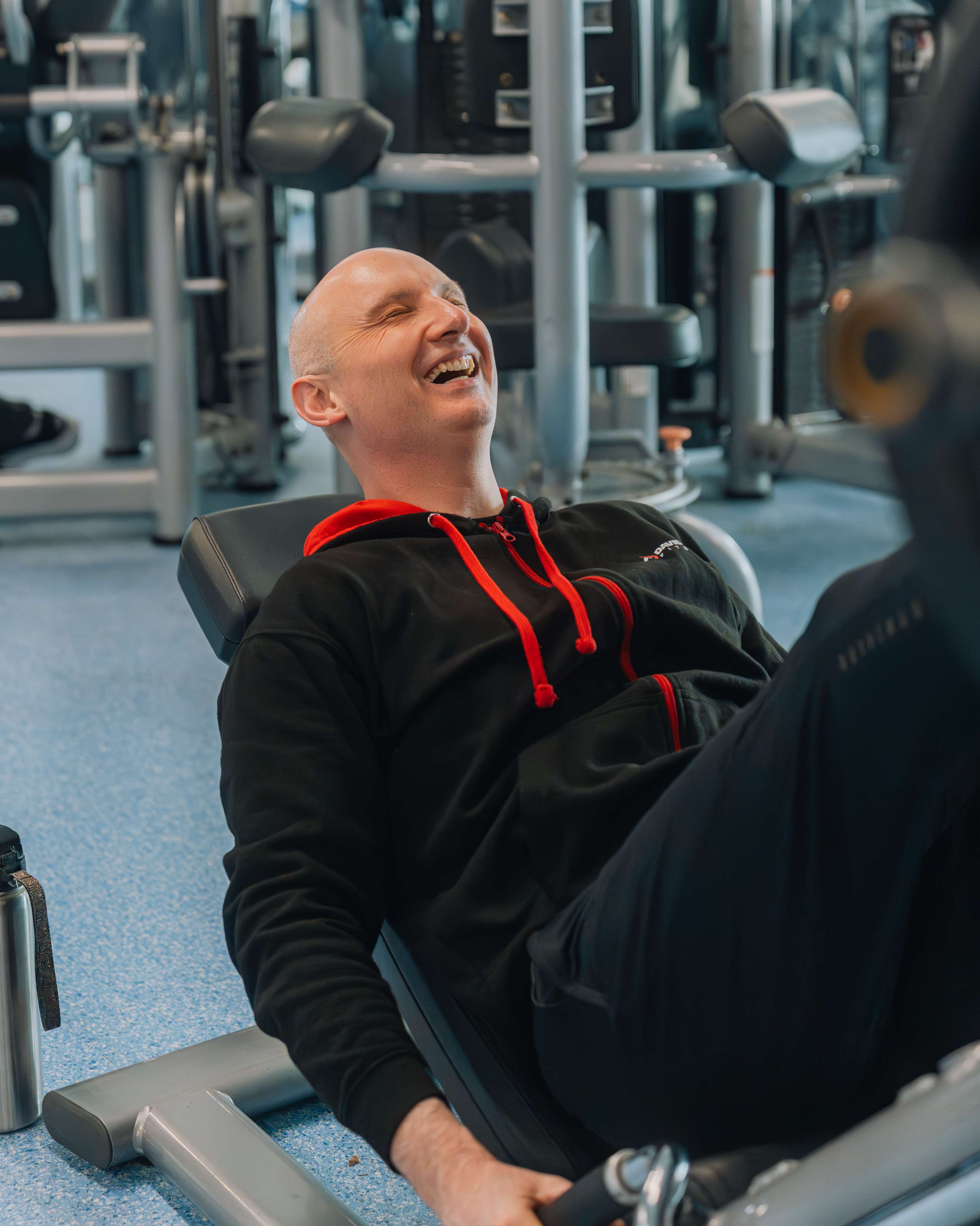 Personal trainer in Norwich smiling and laughing during a relaxed and enjoyable personal training session