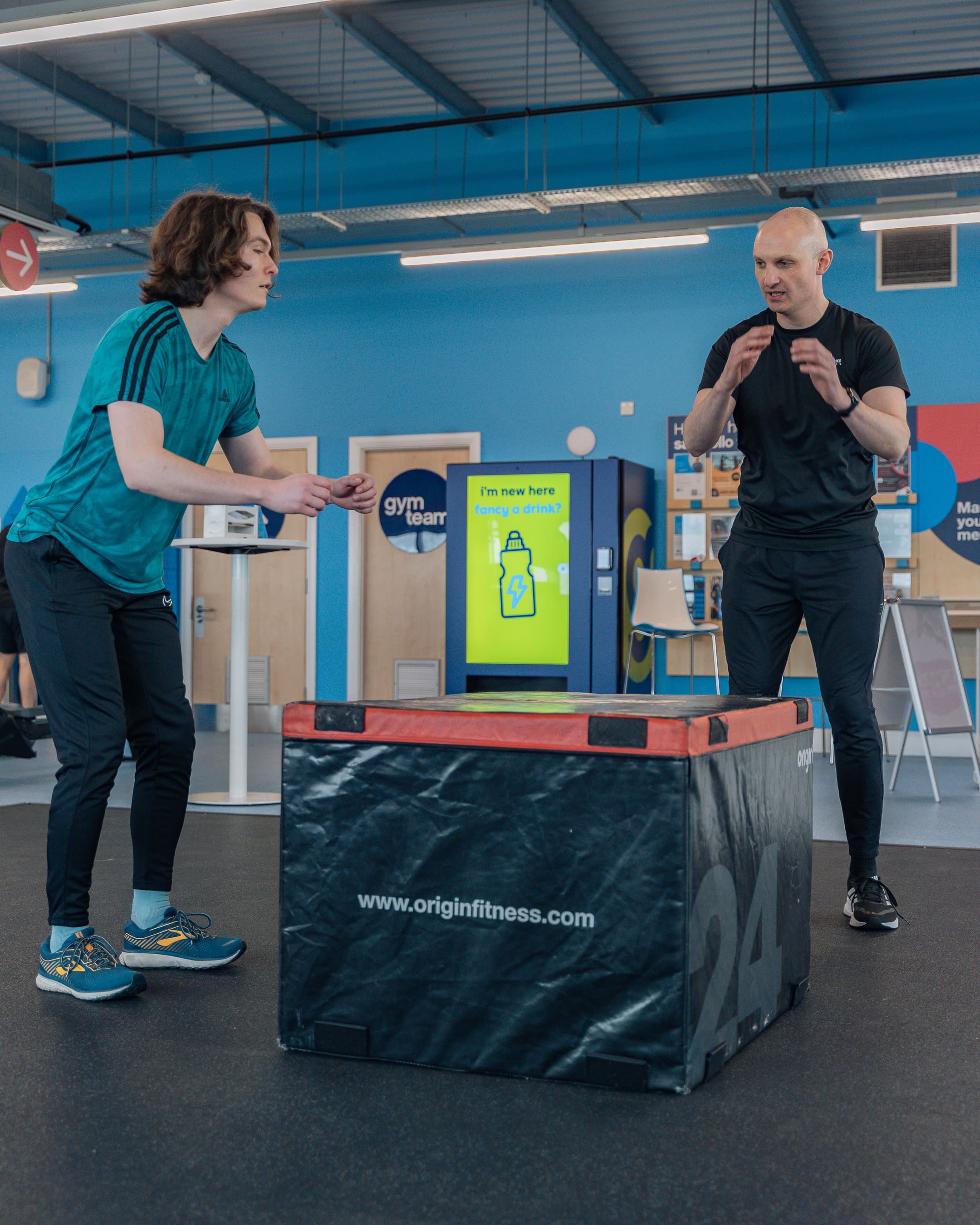 Personal trainer in Norwich coaching a client during a gym training session